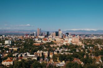 a view of a city with mountains in the background