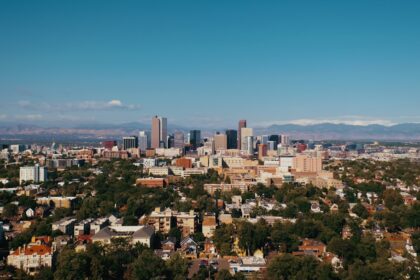 a view of a city with mountains in the background