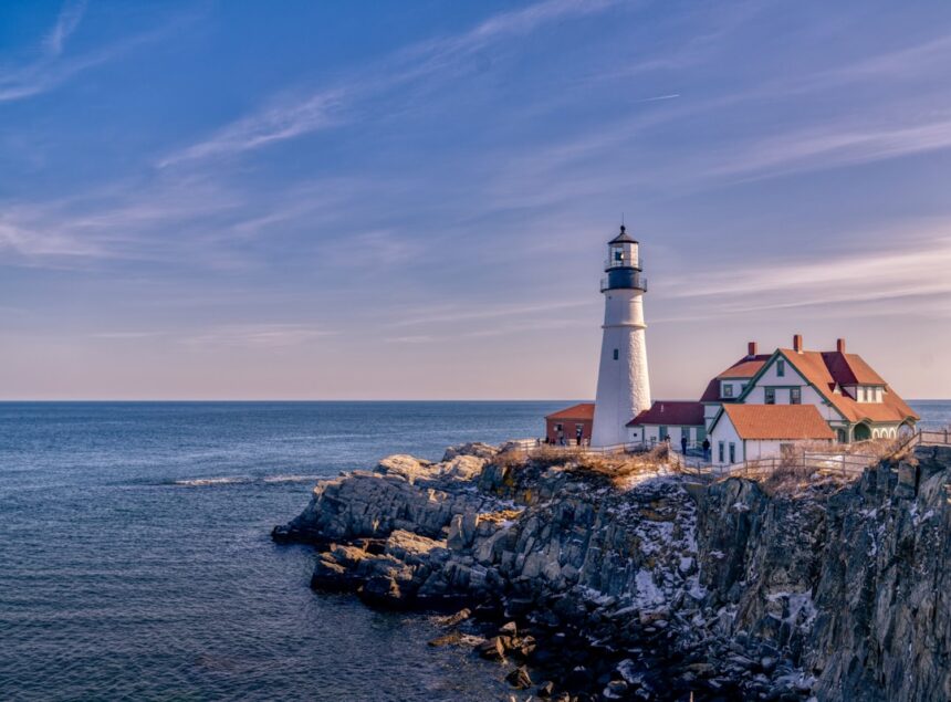 Portland Head Light on a rocky cliff above the ocean in Cape Elizabeth