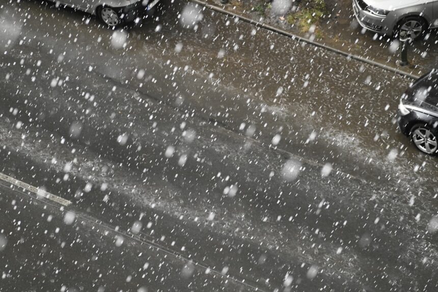 two cars parked on the side of the road in the snow