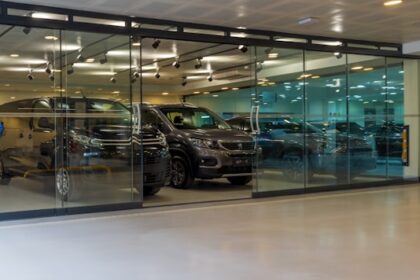 A car showroom with a lot of cars in it