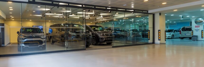 A car showroom with a lot of cars in it