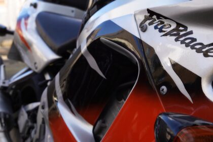 Close-up of a red and white motorcycle with fireblade text