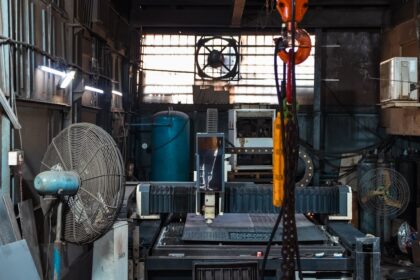 Industrial workshop with machinery and fans