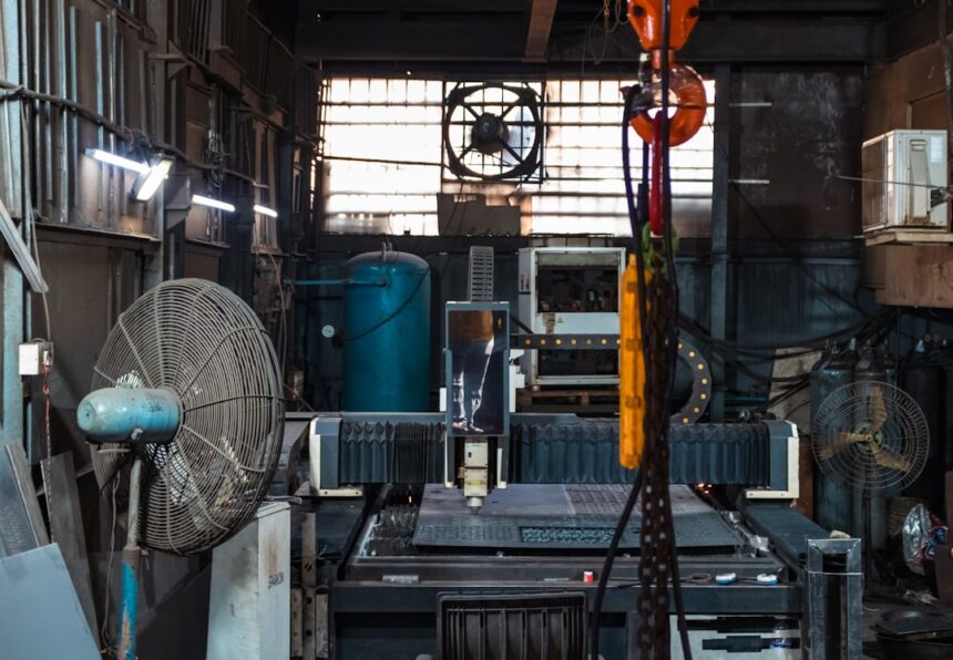 Industrial workshop with machinery and fans