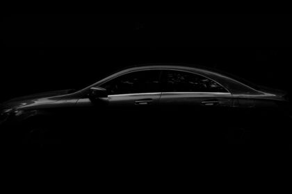 a car is shown in the dark with its door open