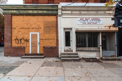 brown brick building with glass window