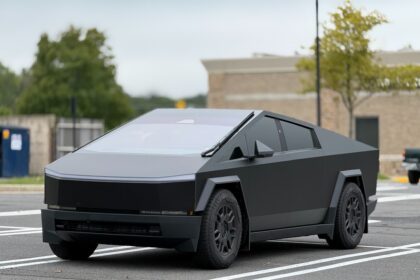 A futuristic car is parked in a parking lot
