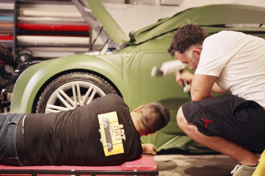 a man is working on a car in a garage