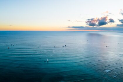 a large body of water with a sky background