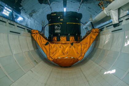 a large piece of luggage sitting inside of a tunnel