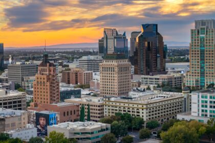 Cityscape with tall buildings at sunset