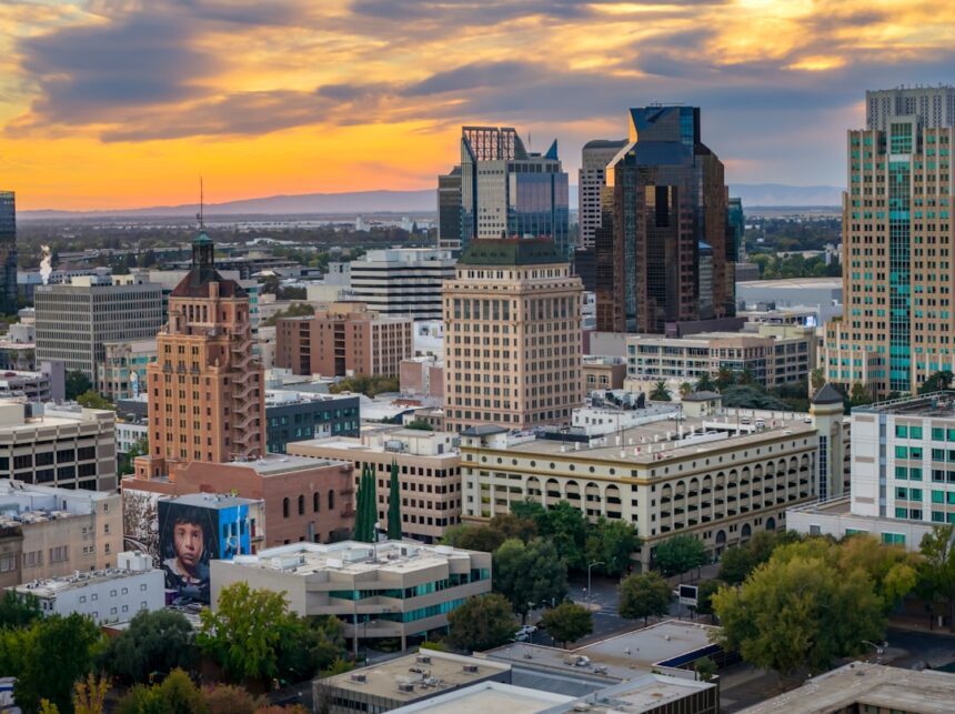 Cityscape with tall buildings at sunset