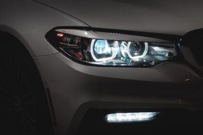gray car with white and blue lights