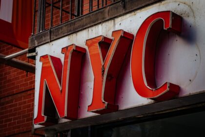 a close up of a sign on the side of a building