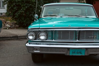 A green car parked on the side of the road
