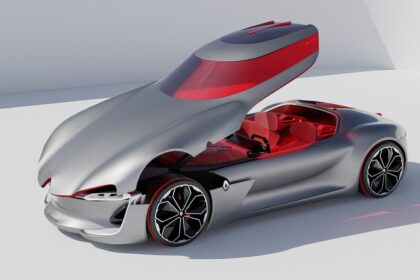 A silver car with a red interior on a white surface