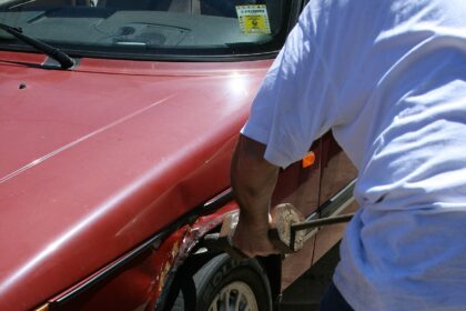 2008-08-11 Mechanic straightening fender.jpg