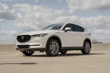 White Mazda CX-5 parked on a rooftop deck, front three-quarter view