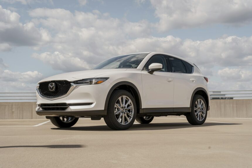 White Mazda CX-5 parked on a rooftop deck, front three-quarter view