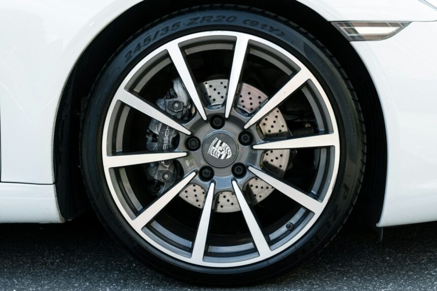 Multi-spoke alloy wheel and tyre on a parked car
