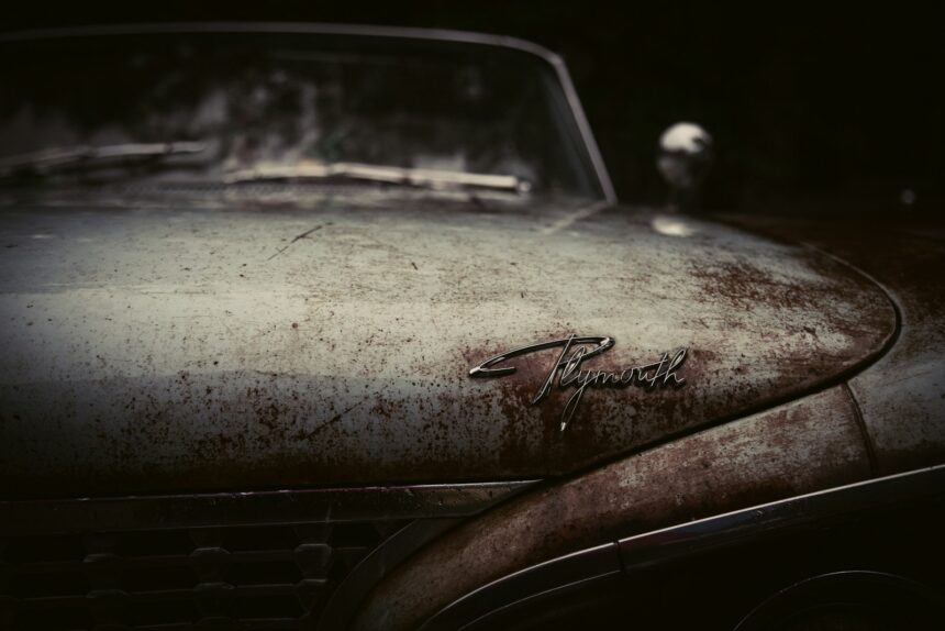 Sun-faded and oxidised paint on a car hood