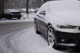 Car covered in winter road slush and salt spray