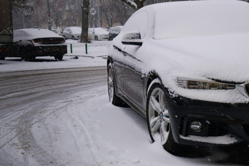 Car covered in winter road slush and salt spray